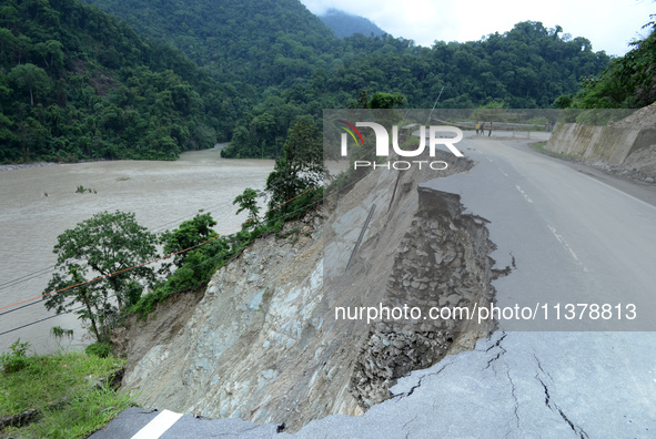 A washed-away portion of the NH10 highway alongside the Teesta River is connecting Sikkim and West Bengal states in the Sevok area, some 35...