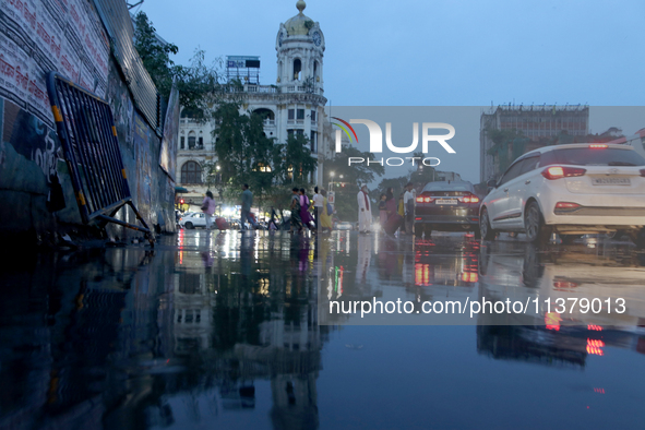 A busy road is becoming waterlogged during the monsoon rain in Kolkata, India, on July 2, 2024. 