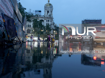 A busy road is becoming waterlogged during the monsoon rain in Kolkata, India, on July 2, 2024. (