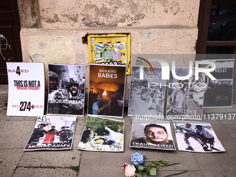 Banners are seen during solidarity with Palestine demonstration at Kazimierz, the Jewish historic district in Krakow, Poland on June 30, 202...