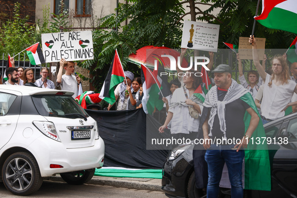 People attend solidarity with Palestine demonstration at Kazimierz, the Jewish historic district in Krakow, Poland on June 30, 2024.  A prot...