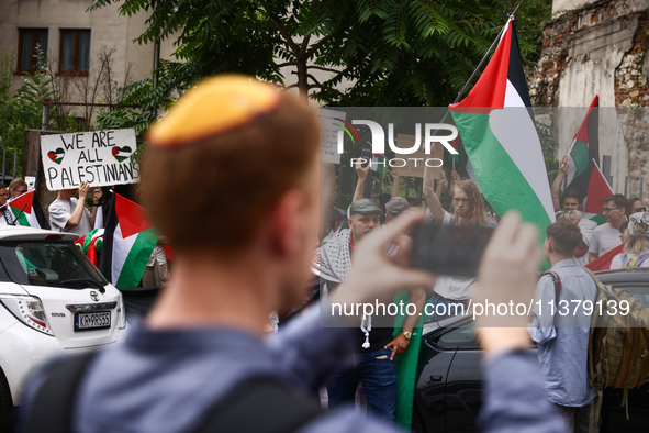 People attend solidarity with Palestine demonstration at Kazimierz, the Jewish historic district in Krakow, Poland on June 30, 2024.  A prot...