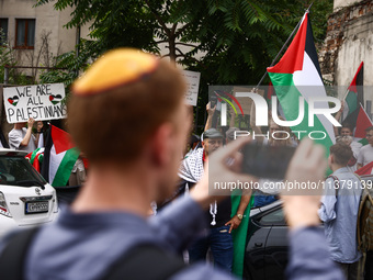 People attend solidarity with Palestine demonstration at Kazimierz, the Jewish historic district in Krakow, Poland on June 30, 2024.  A prot...