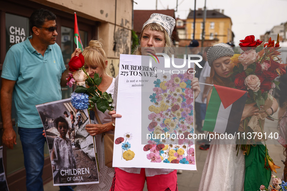 People attend solidarity with Palestine demonstration at Kazimierz, the Jewish historic district in Krakow, Poland on June 30, 2024.  A prot...