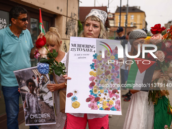 People attend solidarity with Palestine demonstration at Kazimierz, the Jewish historic district in Krakow, Poland on June 30, 2024.  A prot...