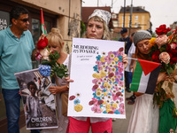 People attend solidarity with Palestine demonstration at Kazimierz, the Jewish historic district in Krakow, Poland on June 30, 2024.  A prot...