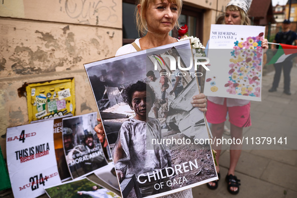 People attend solidarity with Palestine demonstration at Kazimierz, the Jewish historic district in Krakow, Poland on June 30, 2024.  A prot...