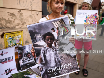 People attend solidarity with Palestine demonstration at Kazimierz, the Jewish historic district in Krakow, Poland on June 30, 2024.  A prot...