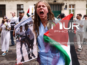 A woman attends solidarity with Palestine demonstration at Kazimierz, the Jewish historic district in Krakow, Poland on June 30, 2024.  A pr...