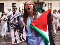 A woman attends solidarity with Palestine demonstration at Kazimierz, the Jewish historic district in Krakow, Poland on June 30, 2024.  A pr...