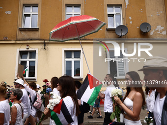 People attend solidarity with Palestine demonstration marching in Kazimierz, the Jewish historic district in Krakow, Poland on June 30, 2024...