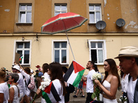 People attend solidarity with Palestine demonstration marching in Kazimierz, the Jewish historic district in Krakow, Poland on June 30, 2024...