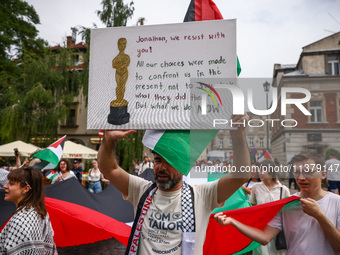 People attend solidarity with Palestine demonstration marching in Kazimierz, the Jewish historic district in Krakow, Poland on June 30, 2024...