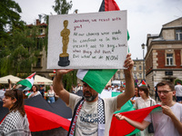 People attend solidarity with Palestine demonstration marching in Kazimierz, the Jewish historic district in Krakow, Poland on June 30, 2024...