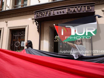 People attend solidarity with Palestine demonstration marching in Kazimierz, the Jewish historic district in Krakow, Poland on June 30, 2024...