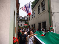 People attend solidarity with Palestine demonstration marching in Kazimierz, the Jewish historic district in Krakow, Poland on June 30, 2024...