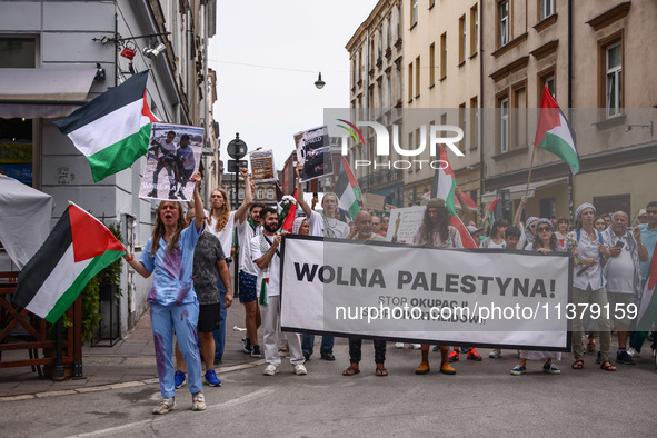 People hold 'Free Palestine' banner while attending solidarity with Palestine demonstration in front of the Jewish Community Center (JCC) in...