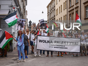 People hold 'Free Palestine' banner while attending solidarity with Palestine demonstration in front of the Jewish Community Center (JCC) in...