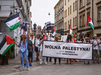 People hold 'Free Palestine' banner while attending solidarity with Palestine demonstration in front of the Jewish Community Center (JCC) in...