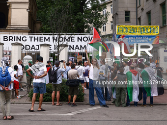 People attend solidarity with Palestine demonstration in front of the Jewish Community Center (JCC) in Kazimierz, the Jewish historic distri...