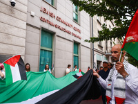 People attend solidarity with Palestine demonstration in front of the Jewish Community Center (JCC) in Kazimierz, the Jewish historic distri...