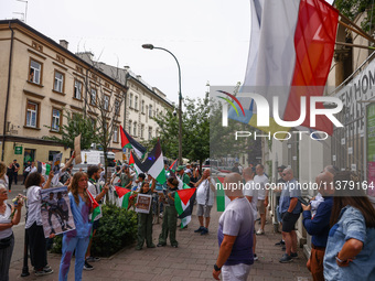 People attend solidarity with Palestine demonstration in front of the Jewish Community Center (JCC) in Kazimierz, the Jewish historic distri...