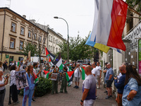 People attend solidarity with Palestine demonstration in front of the Jewish Community Center (JCC) in Kazimierz, the Jewish historic distri...