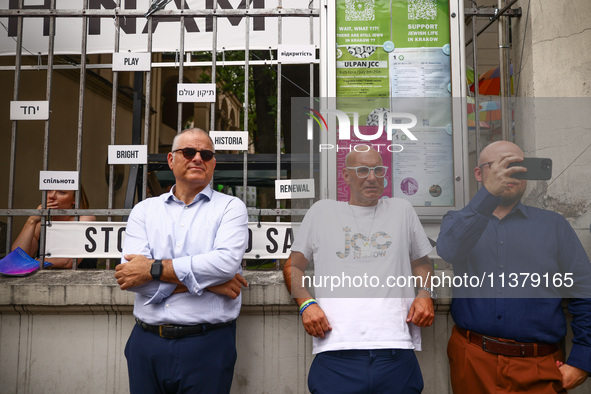 Rabbi Avi Baumol s (Left) and Jonathan Ornstein, the director of the Jewish Community Center (JCC) stand while solidarity with Palestine dem...