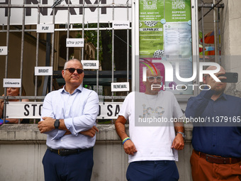 Rabbi Avi Baumol s (Left) and Jonathan Ornstein, the director of the Jewish Community Center (JCC) stand while solidarity with Palestine dem...