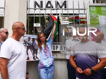 Rabbi Avi Baumol s (Left) and Jonathan Ornstein, the director of the Jewish Community Center (JCC) stand surrounded by bodyguards while soli...