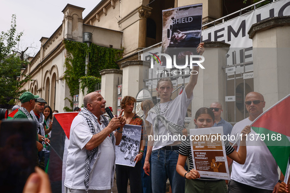 People attend solidarity with Palestine demonstration in front of the Jewish Community Center (JCC) in Kazimierz, the Jewish historic distri...