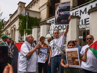 People attend solidarity with Palestine demonstration in front of the Jewish Community Center (JCC) in Kazimierz, the Jewish historic distri...