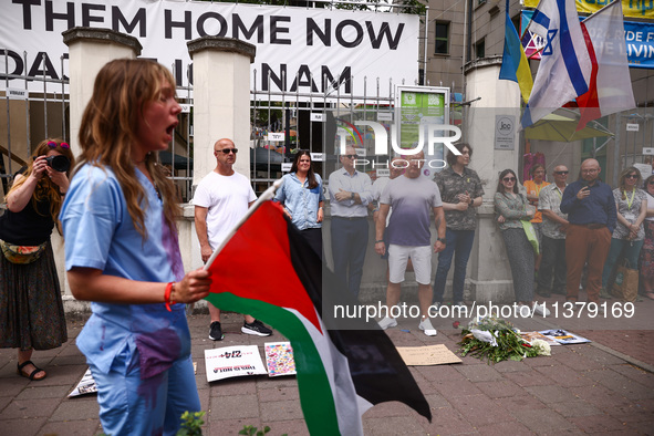 People attend solidarity with Palestine demonstration in front of the Jewish Community Center (JCC) in Kazimierz, the Jewish historic distri...