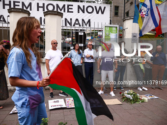 People attend solidarity with Palestine demonstration in front of the Jewish Community Center (JCC) in Kazimierz, the Jewish historic distri...