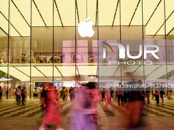 People are experiencing Apple products at an Apple product store in Hangzhou, China, on June 18, 2024. On July 2, 2024, Apple's Vision Pro s...