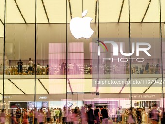 People are experiencing Apple products at an Apple product store in Hangzhou, China, on June 18, 2024. On July 2, 2024, Apple's Vision Pro s...