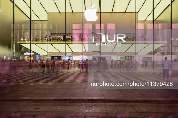 People are experiencing Apple products at an Apple product store in Hangzhou, China, on June 18, 2024. On July 2, 2024, Apple's Vision Pro s...