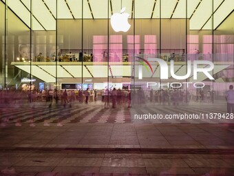 People are experiencing Apple products at an Apple product store in Hangzhou, China, on June 18, 2024. On July 2, 2024, Apple's Vision Pro s...