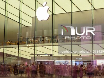 People are experiencing Apple products at an Apple product store in Hangzhou, China, on June 18, 2024. On July 2, 2024, Apple's Vision Pro s...