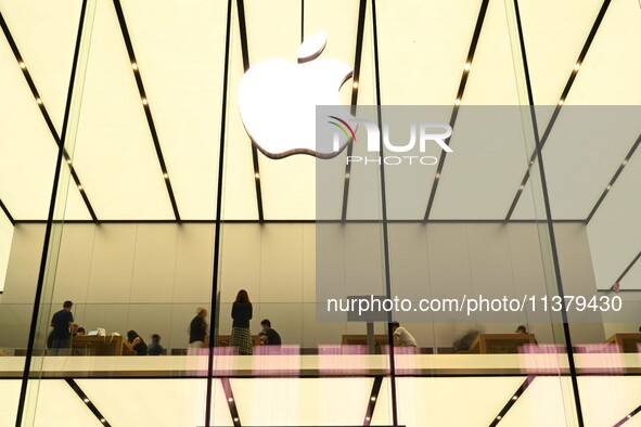 People are experiencing Apple products at an Apple product store in Hangzhou, China, on June 18, 2024. On July 2, 2024, Apple's Vision Pro s...