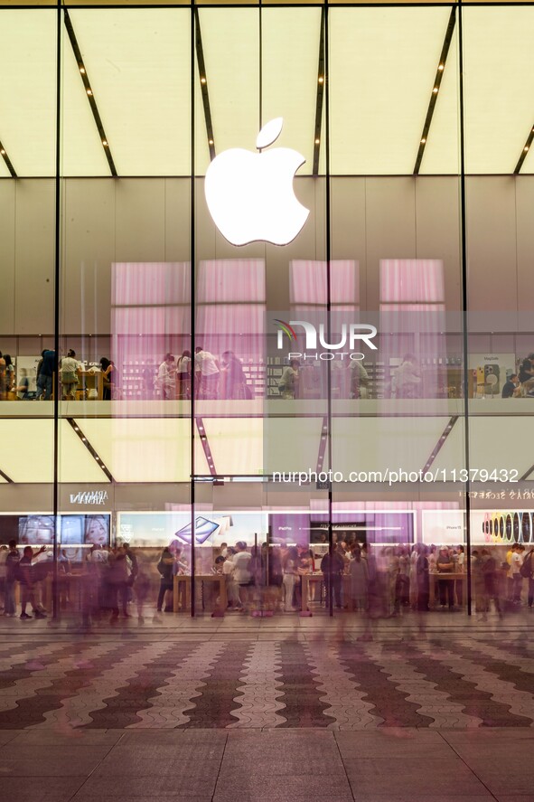 People are experiencing Apple products at an Apple product store in Hangzhou, China, on June 18, 2024. On July 2, 2024, Apple's Vision Pro s...