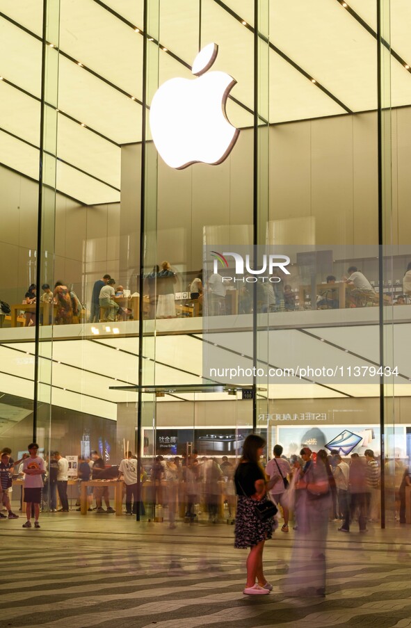 People are experiencing Apple products at an Apple product store in Hangzhou, China, on June 18, 2024. On July 2, 2024, Apple's Vision Pro s...