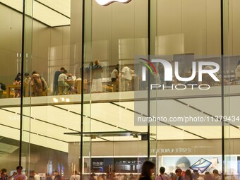 People are experiencing Apple products at an Apple product store in Hangzhou, China, on June 18, 2024. On July 2, 2024, Apple's Vision Pro s...