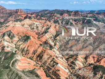 An aerial photo is showing the Danxia landform group in Xinghua village, Lanzhou city, northwest China's Gansu province, in Lanzhou, China,...