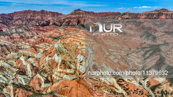 An aerial photo is showing the Danxia landform group in Xinghua village, Lanzhou city, northwest China's Gansu province, in Lanzhou, China,...