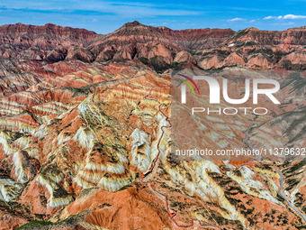 An aerial photo is showing the Danxia landform group in Xinghua village, Lanzhou city, northwest China's Gansu province, in Lanzhou, China,...