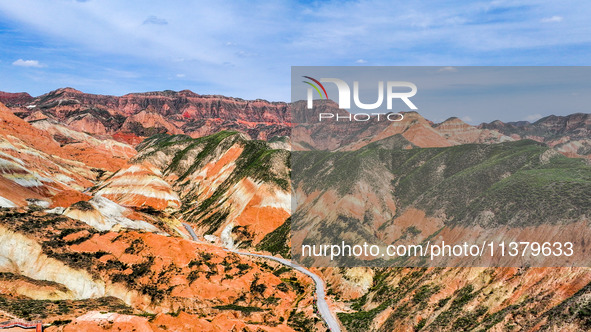 An aerial photo is showing the Danxia landform group in Xinghua village, Lanzhou city, northwest China's Gansu province, in Lanzhou, China,...