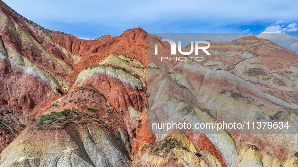 An aerial photo is showing the Danxia landform group in Xinghua village, Lanzhou city, northwest China's Gansu province, in Lanzhou, China,...