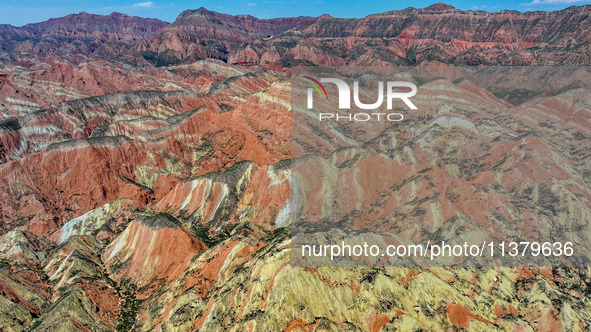 An aerial photo is showing the Danxia landform group in Xinghua village, Lanzhou city, northwest China's Gansu province, in Lanzhou, China,...