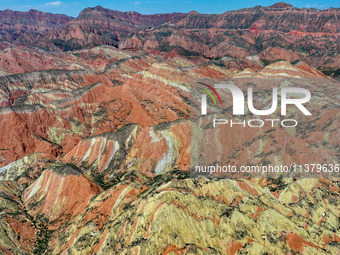 An aerial photo is showing the Danxia landform group in Xinghua village, Lanzhou city, northwest China's Gansu province, in Lanzhou, China,...